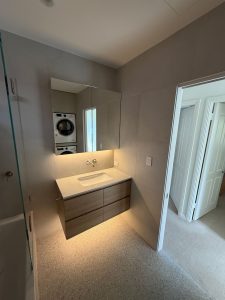 Bathroom renovation, Naremburn: timber floating vanity with LED-lit shaving cabinet after
